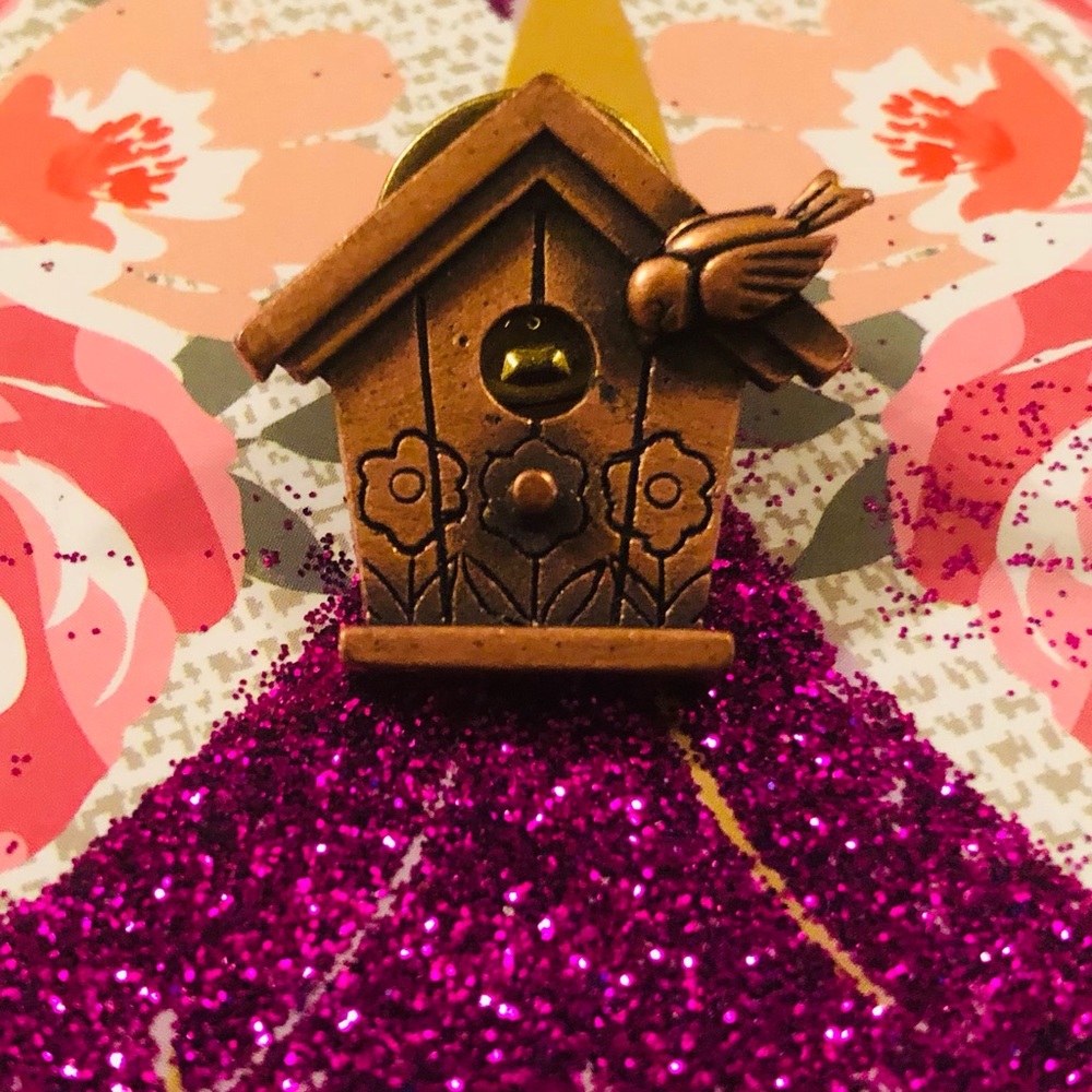 Very cute copper color birdhouse lapel pin.